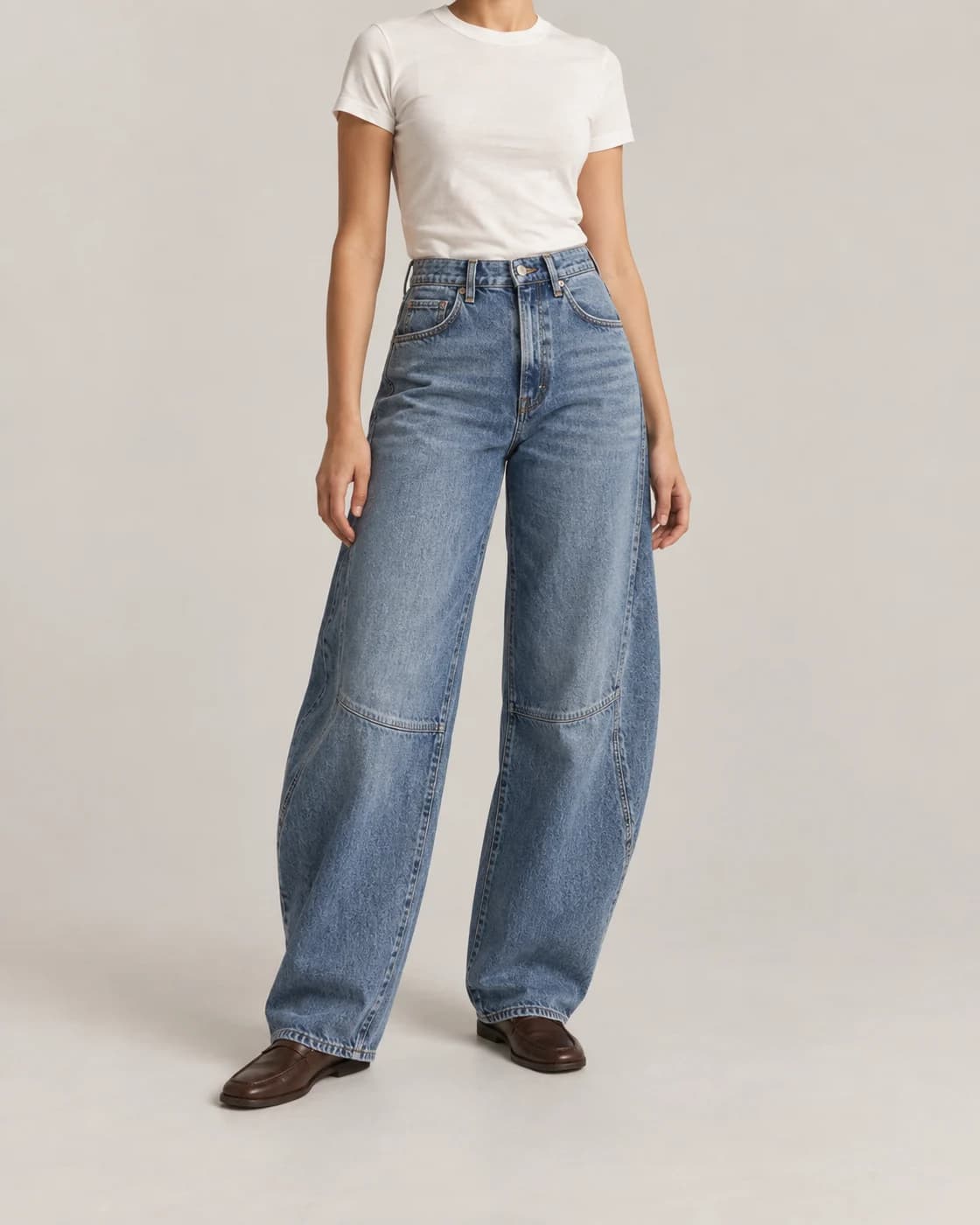 Mid-blue barrel jeans styled with a fitted white tee